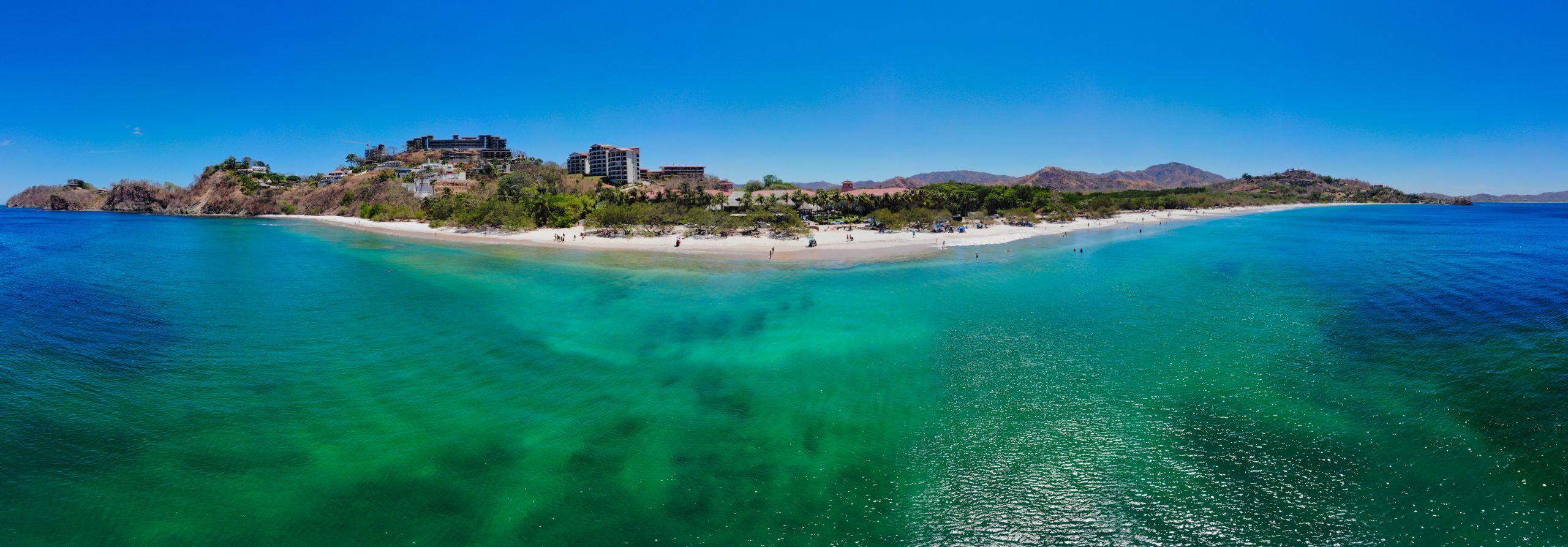 Aerial view of Playa Flamingo Beach with turquoise water and shoreline, highlighting things to do Playa Flamingo