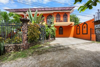 Casa de Sueños Playa Potrero exterior view with balcony and gated entry | Costa Rica Real Estate CR