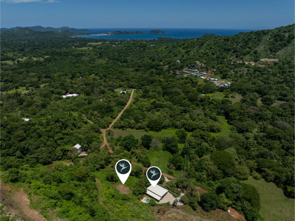 Aerial view of Casa Shambala, an investment property in Playa Potrero Costa Rica with additional lot and ocean nearby.