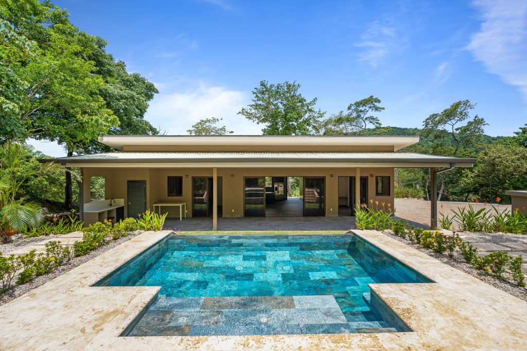 Casa Shambala, a 4 bedroom home with pool in Playa Potrero Costa Rica, featuring a modern exterior and private pool.