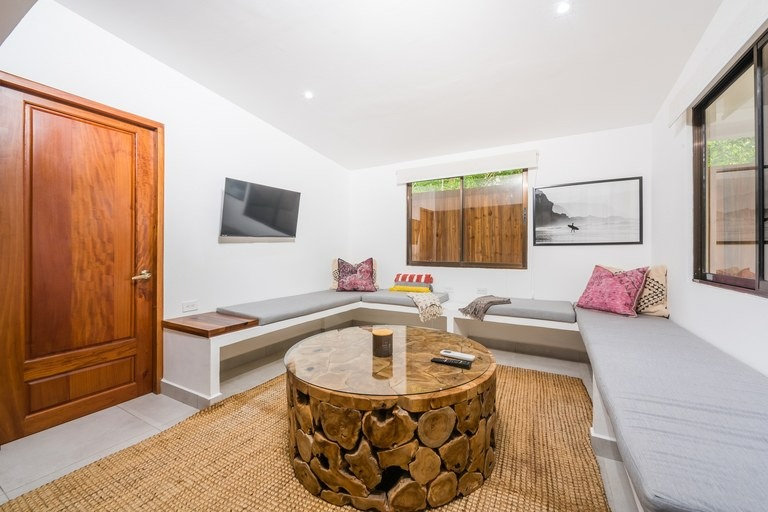 Furnished living area at Casa Mar Agradable, part of a Playa Potrero investment property for sale