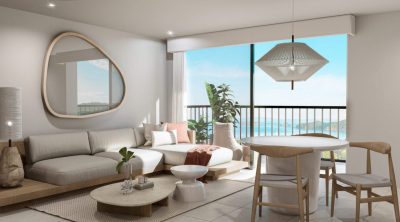 Modern living room with ocean-view balcony at Pacífico Luxury Condos in Playas del Coco
