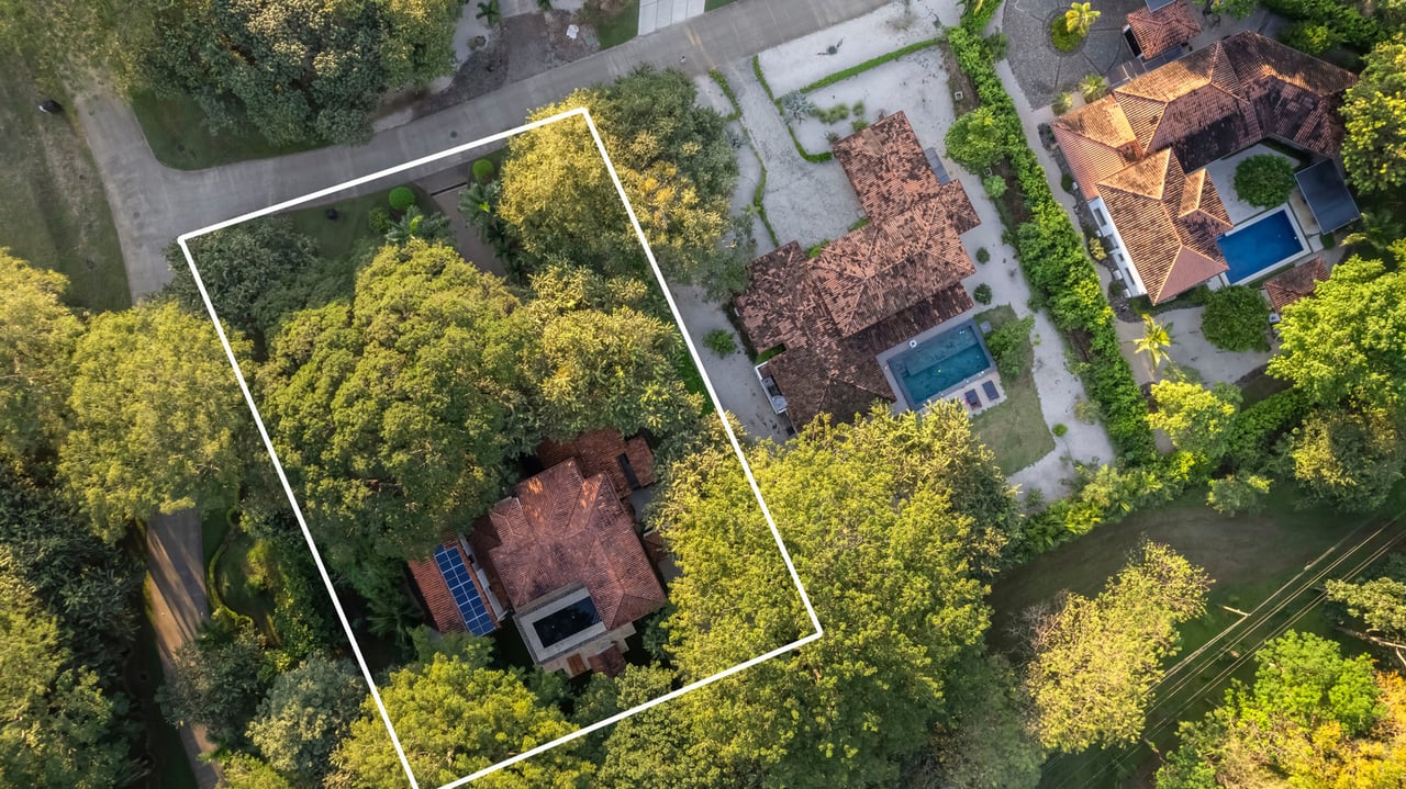 Aerial view of Casa Serenity on a private treed lot, Spanish colonial estate in Guanacaste