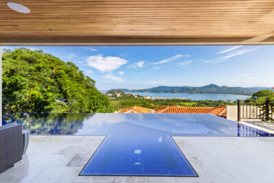 Infinity-edge pool at Casa Todo Bien & Guest House Playa Flamingo with panoramic views | Costa Rica Real Estate CR