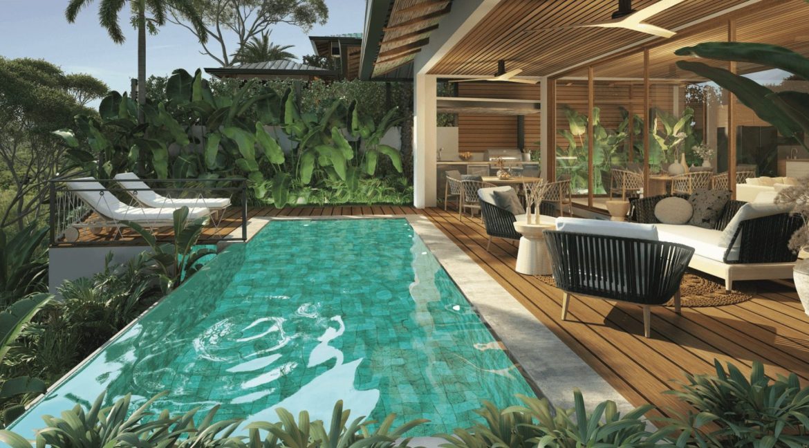 Private pool at Casa Palma Real with wooden deck, turquoise water, and tropical landscaping, Costa Rica Real Estate Cr