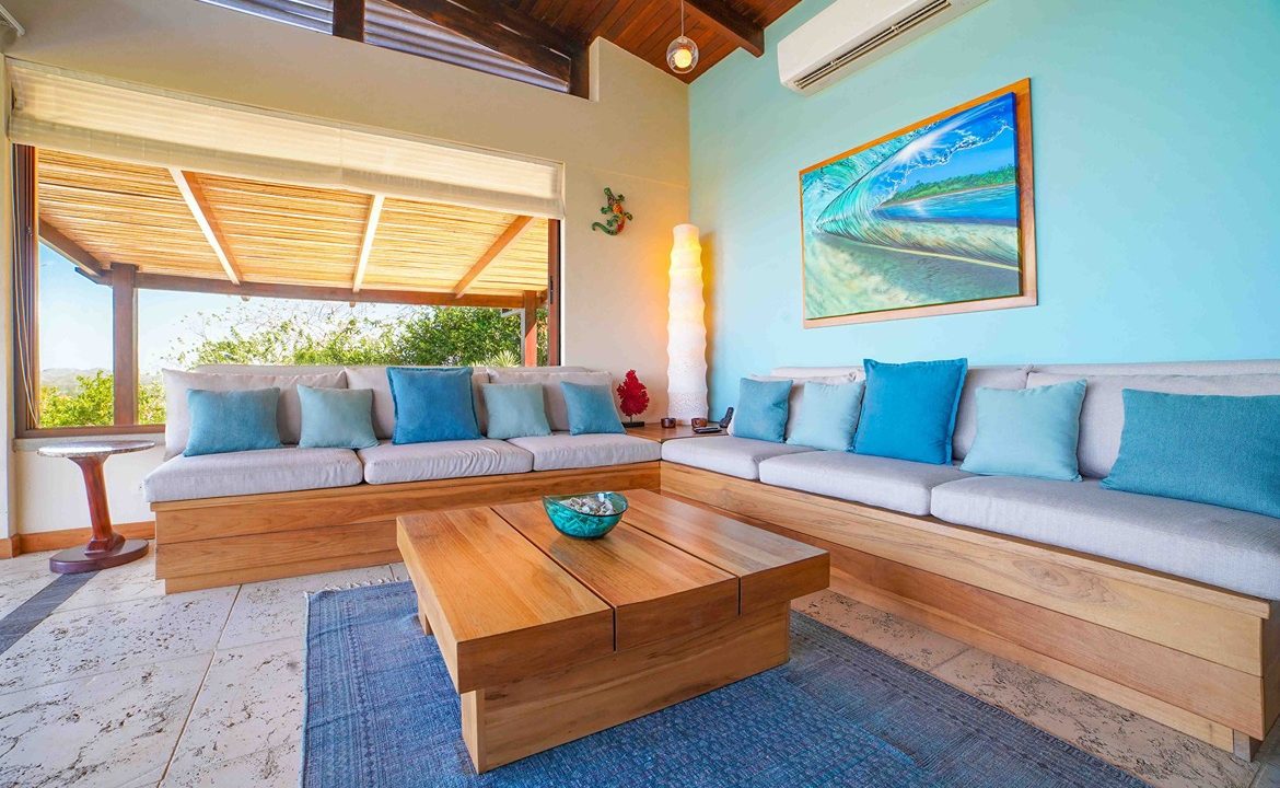 Cozy living nook with ocean-view seating and coffee table in Tamarindo luxury estate — Costa Rica Real Estate Cr
