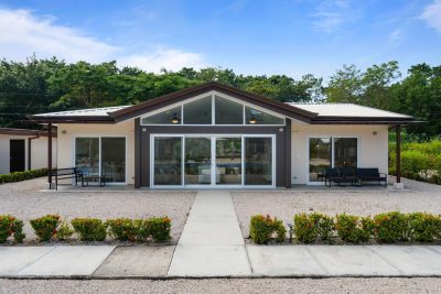 Modern three-bedroom home at The Point in Playa Avellanas with contemporary design and landscaped entry