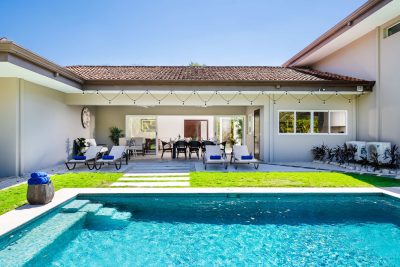 Private pool and patio at Casa Kenya Las Brisas 60 in Hacienda Pinilla with outdoor seating and landscaped yard