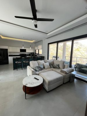 Modern living room and kitchen at Vista Verde Mar Vista rental by Costa Rica Realestate cr