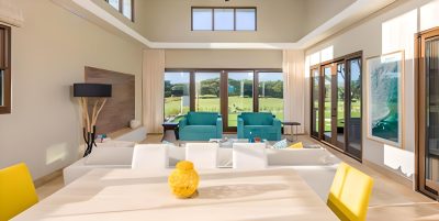 Open-concept living and dining area at Casa de Mar with golf views and natural light
