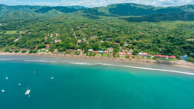 Aerial view of Surfside Playa Potrero Costa Rica, showcasing beachfront homes, lush greenery, and real estate for sale.