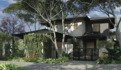 Front exterior of Tamarindo Park Casa 70 surrounded by tropical trees | Costa Rica Real Estate CR