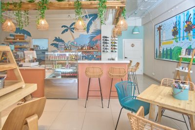 Interior seating area and coffee bar at Cha Cafe Tamarindo in Tamarindo’s walkable beach town center.