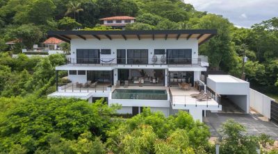 Luxury ocean-view home Casa Canción Del Mar in Potrero with infinity pool, modern architecture, and panoramic coastline views.