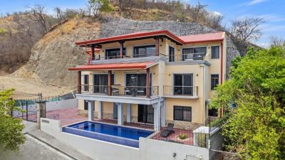 Ocean-view apartment building at Casa Omega in Altos de Flamingo with pool and hillside setting