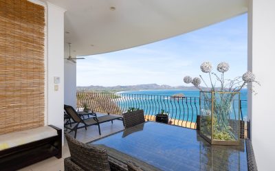 Covered terrace seating with ocean view at Flamingo Towers 23 condo in Playa Flamingo, Guanacaste, Costa Rica