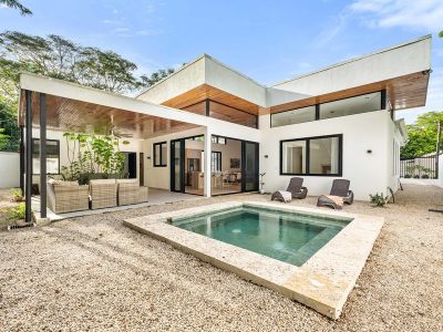 Private pool and covered terrace at Casa Nala, a modern tropical home with office near Potrero Beach in Surfside.