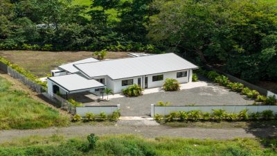 Aerial view of Casa Esperanza, a modern gated home surrounded by greenery in Matapalo, Guanacaste, Costa Rica