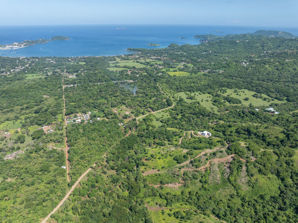 Aerial view of Playa Potrero coastline and green hills near Potrero Hills, close to homes for sale in Playa Potrero