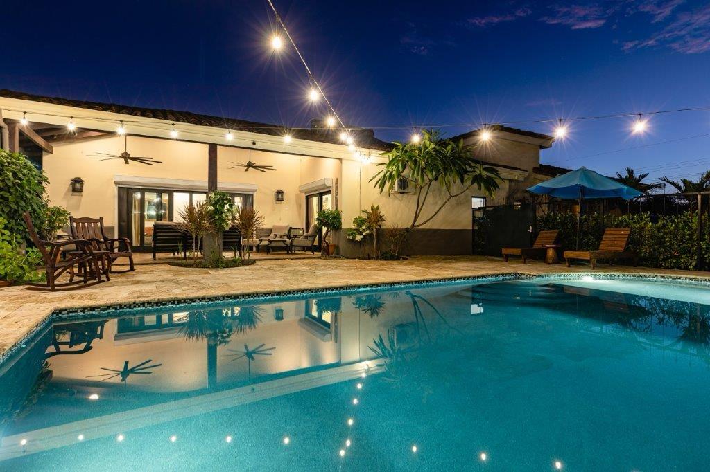 Evening view of Casa Jala in Santa Rosa, Costa Rica with private pool, illuminated terrace, and tropical outdoor living space