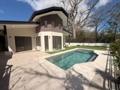 Private pool and fenced yard at Casa Maravilla Playa Potrero with modern exterior and covered terrace