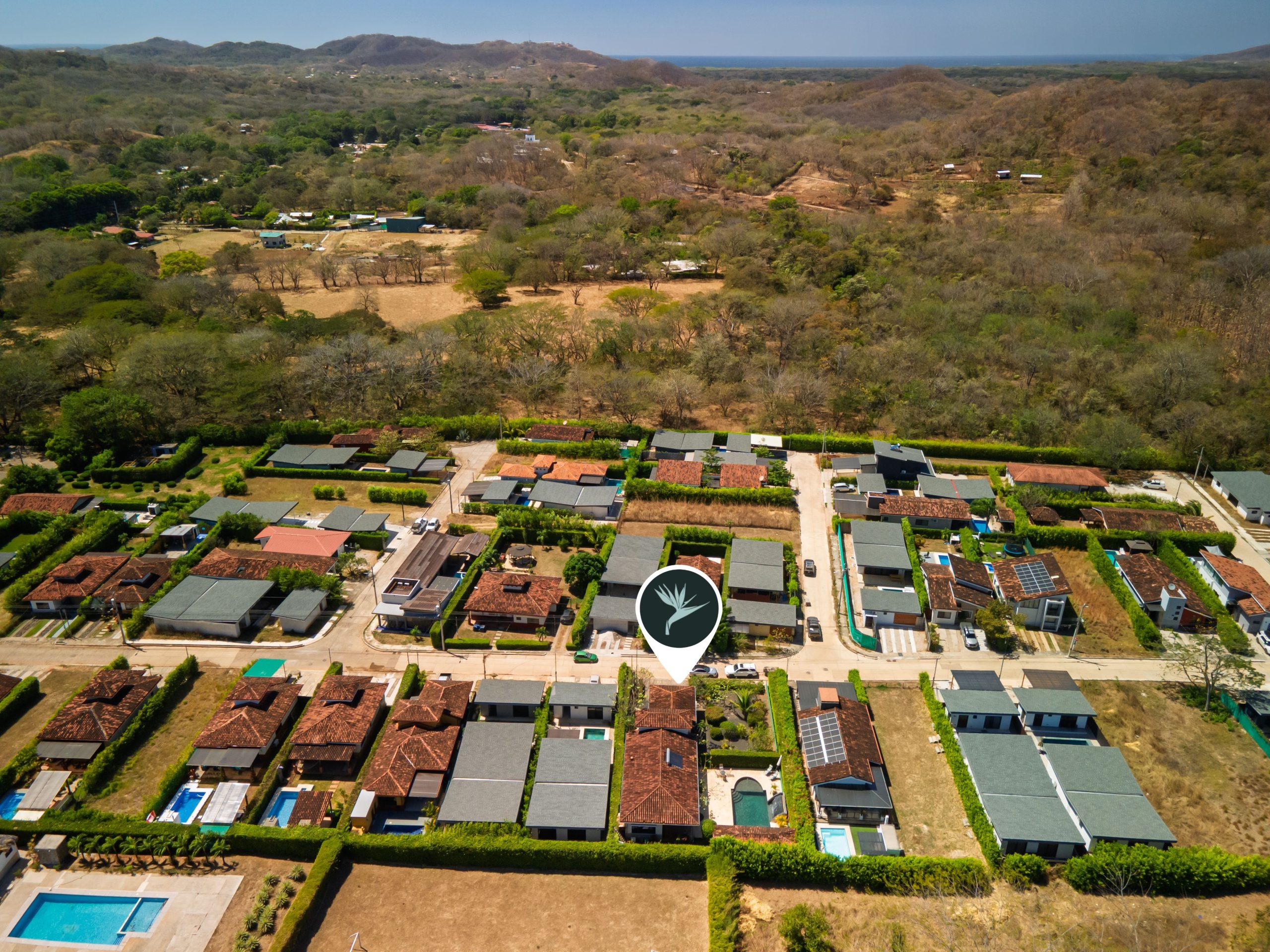Aerial view of Casa Jala in Loma Verde, Santa Rosa, surrounded by homes and hills