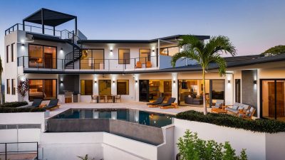 Rear exterior of Villa Vista Pacífico with infinity pool and rooftop terrace in Pacific Heights, Playa Potrero