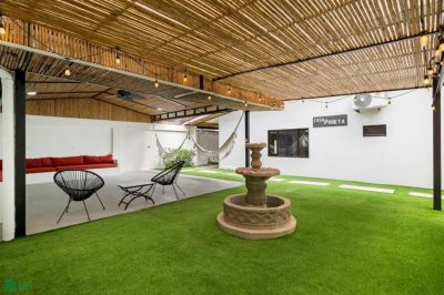 Casa Daniel Playa Potrero outdoor patio with fountain, hammocks, and seating in investment property Potrero