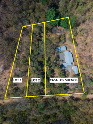 Aerial view of Casa Los Sueños Lots beside a hillside residence in Portegolpe, Guanacaste.