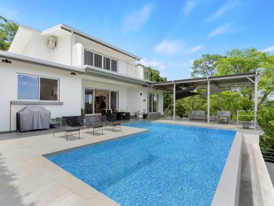 Casa Alto Pinilla infinity pool and terrace overlooking lush hills in Avellanas, Costa Rica ocean view home