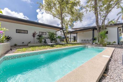 Private pool courtyard at Casa C80 with tropical garden and modern terrace in Playa Potrero