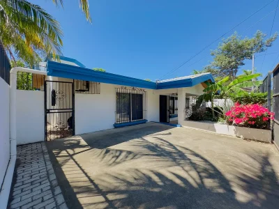 Casa Maranto gated entrance and carport courtyard in Playas del Coco beach home, Guanacaste Costa Rica