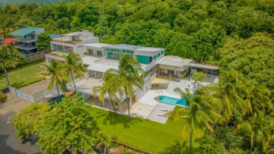 Casa Marejada beachfront property in Playa Potrero with oceanfront pool, palm trees, and modern villa overlooking the Pacific