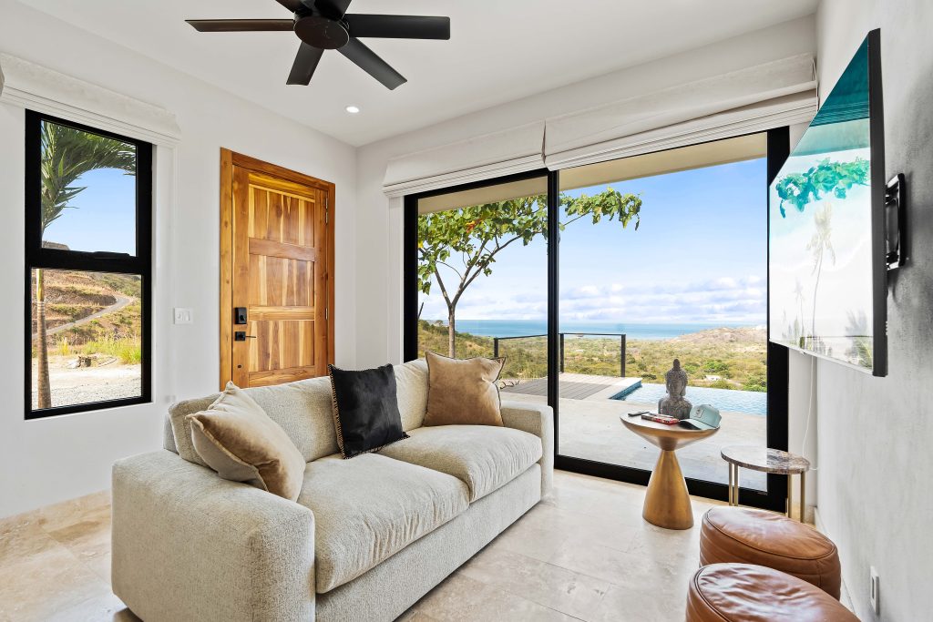 Casita Dorado living room with sliding doors to terrace in Playa Flamingo Costa Rica