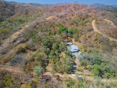 Aerial view of Casa Los Sueños hillside property surrounded by forest, lots for sale in Cabo Velas Costa Rica