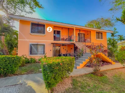 Crisantemos 2 Las Palmas second-floor condo building in Playas del Coco, a walk to beach condo near Café de Playa