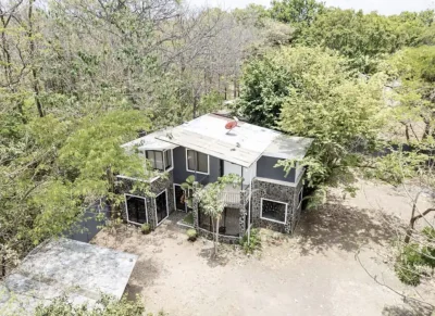 Hidden Gem El Llano home surrounded by trees with driveway and outdoor space, home with large lot Guanacaste Costa Rica