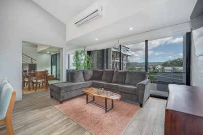 Flamingo Marina Cove living room with large windows and balcony view, Playa Flamingo condo interior