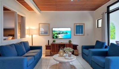 Punta Indio 405 Playa Flamingo living room with seating area and TV, ocean view condo Playa Flamingo