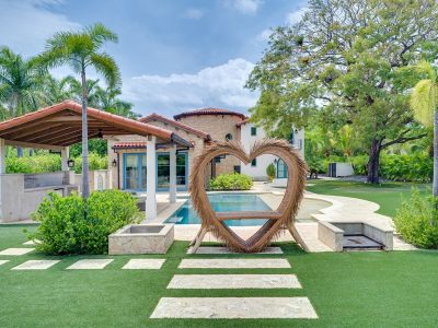 Heart-shaped garden sculpture and pool courtyard at Villa Romantica Hacienda Pinilla, a luxury villa in Hacienda Pinilla, Costa Rica