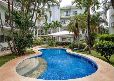 Pool and tropical courtyard at Villa Verde Condo 46 Tamarindo within the Villa Verde Tamarindo condo community