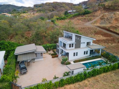 Aerial view of Casa Selamar in Brasilito with a modern main home, guest casita, private pool, and hillside setting.