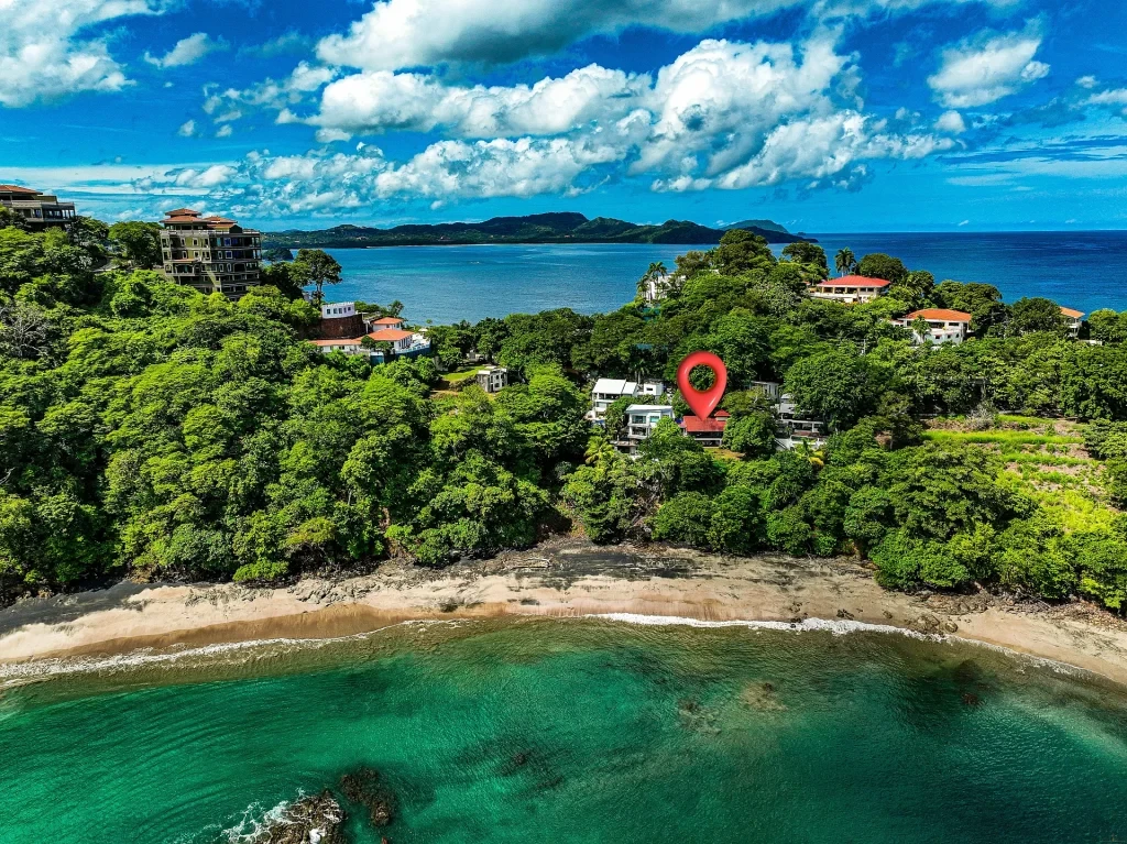 Casa Moon aerial beach view marking an oceanfront home Playa Flamingo Costa Rica with shoreline access