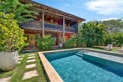 Casa Amaita pool and tropical garden at Playa Negra Costa Rica beachfront gated community home
