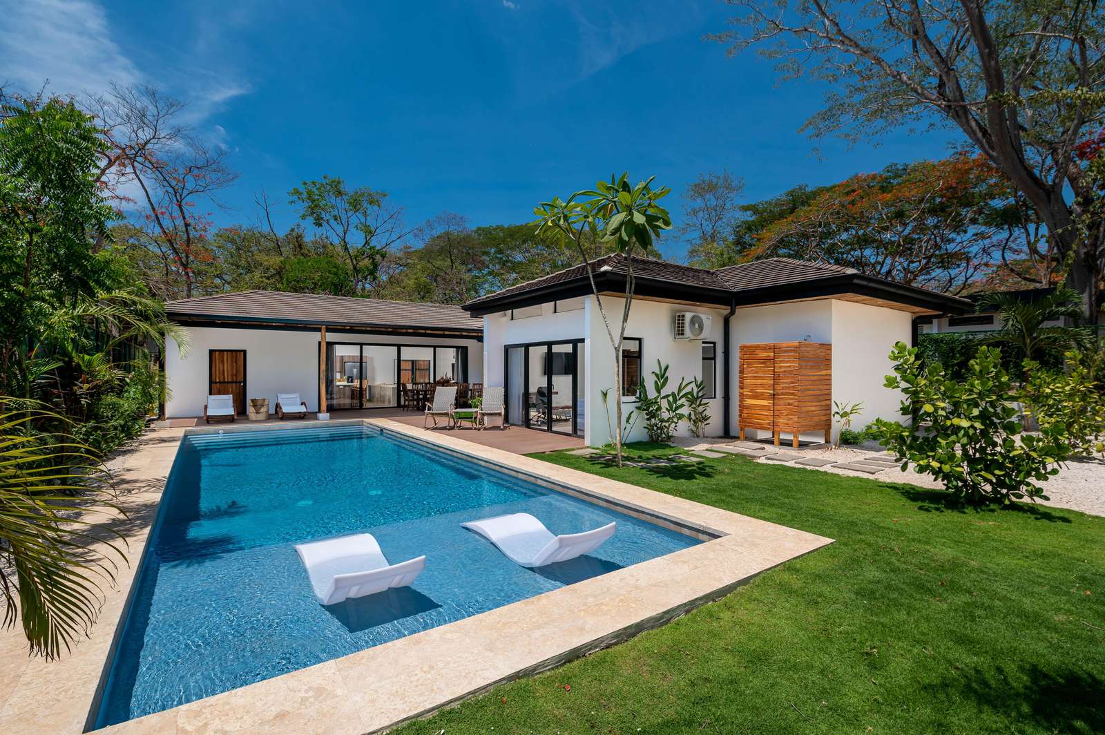 Casa Prema pool and patio, modern Playa Grande beach home with outdoor lounge area and tropical landscaping