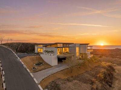 Luxury Hilltop Villa at sunset overlooking coastline, ocean view villa Playa Grande Costa Rica