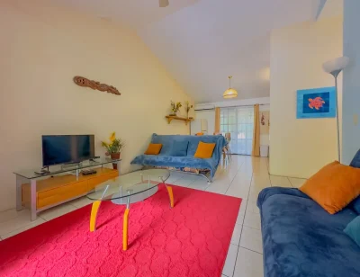 Horizontes 4 Playas del Coco living room with seating and dining area, condo Las Palmas Playas del Coco Costa Rica
