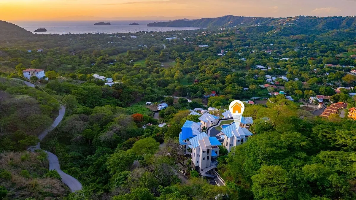 Pacific View House aerial hillside setting in Playas del Coco, a turnkey ocean view villa in private community