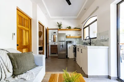 Paradise Condo 6 Tamarindo kitchen and living area with modern finishes in a Tamarindo condo for sale