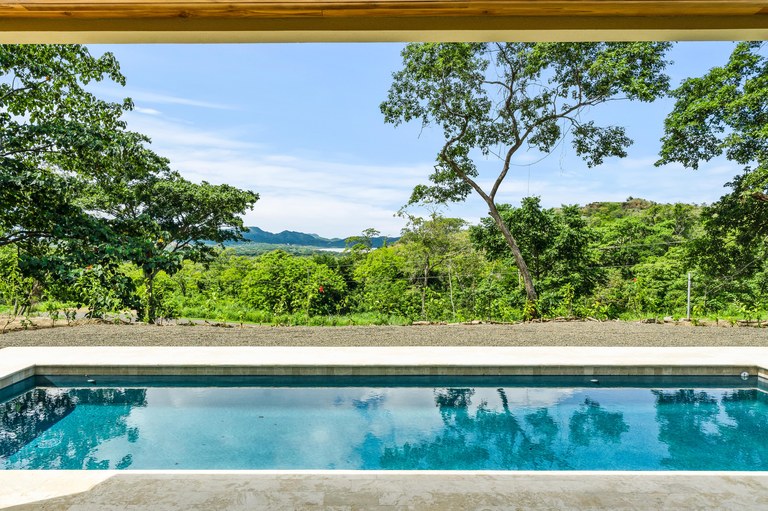 Twin Sister pool with ocean view in Playa Flamingo, an income-producing property in Playa Flamingo